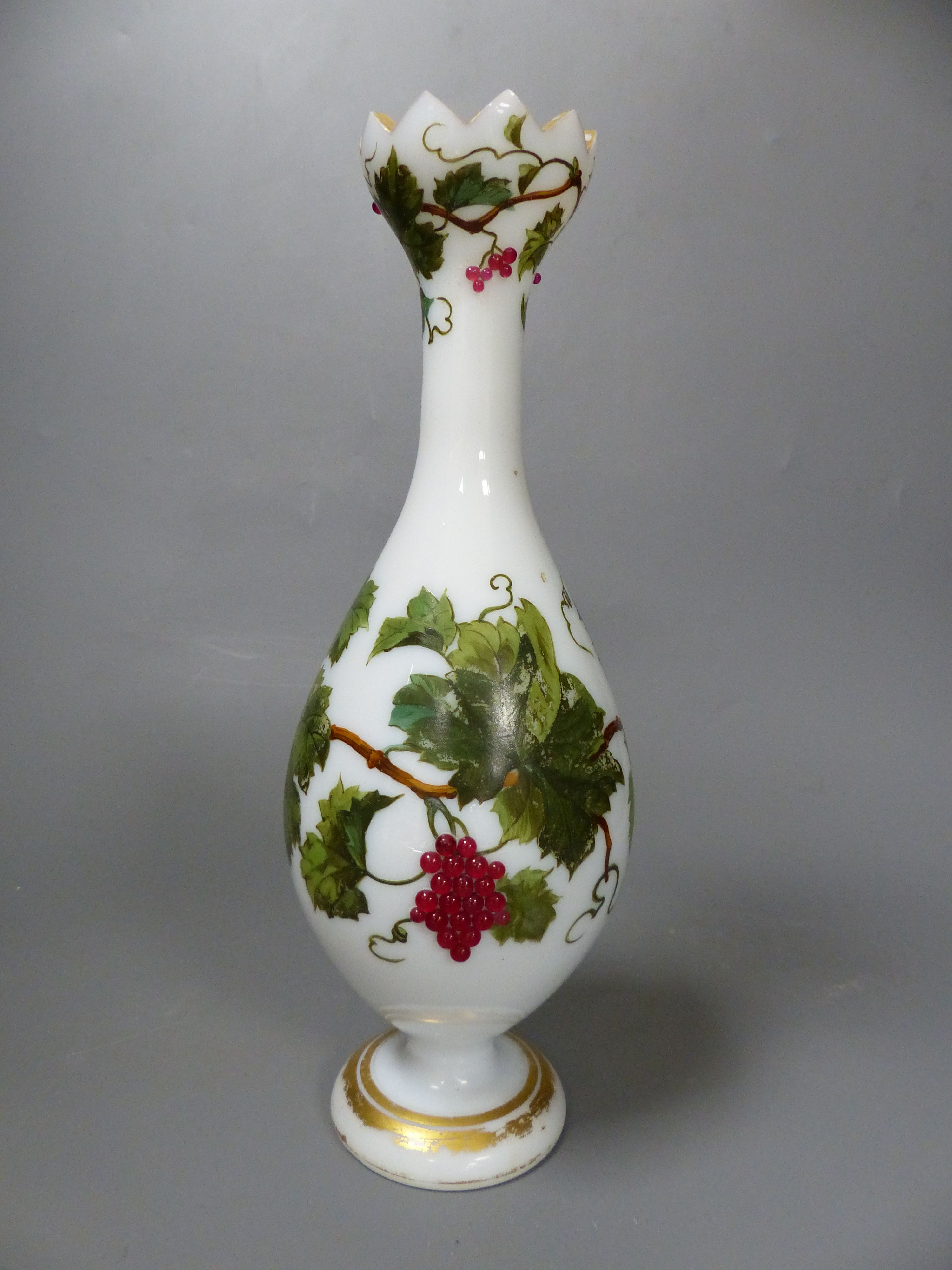 A French opaline glass vase with applied grapes and a pair of Webb style ruby and white glass vases, tallest 26cm